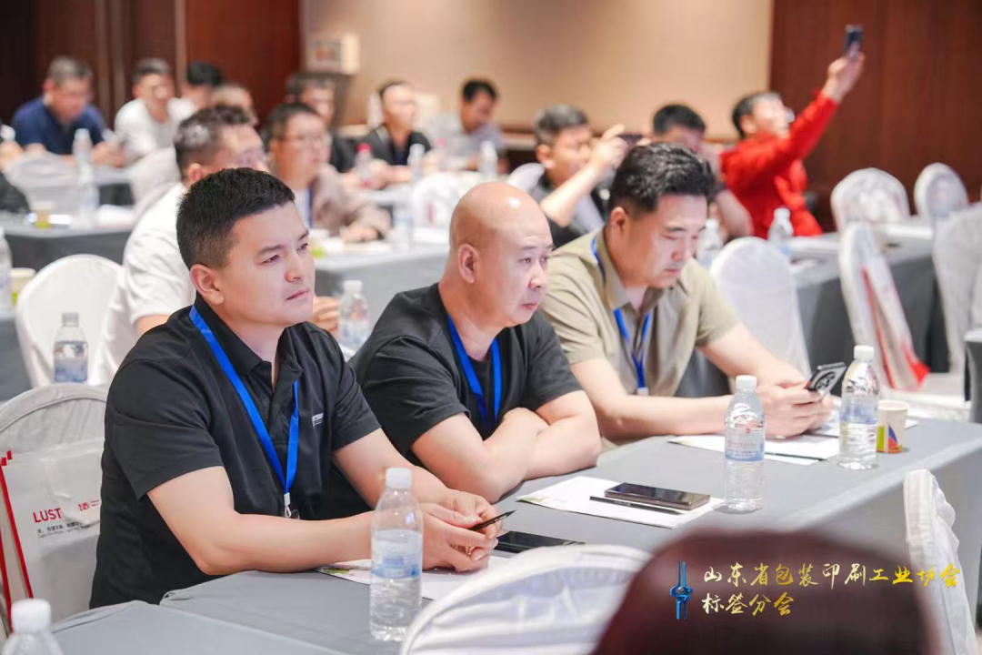 Attendees listen and exchange ideas in a lively atmosphere.